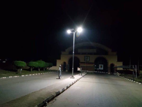 Palm-Solar-Streetlight-All-In-One-Design-that-folds-and-elevates-to-capture-solar-energy-installed-in-Nigeria-night-view--sold-by-TheSolPatch